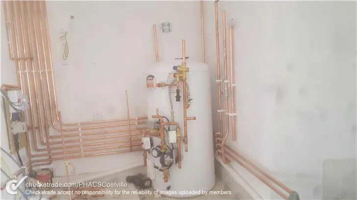 Commercial plant room pipework and heating equipment installed by PHACS
