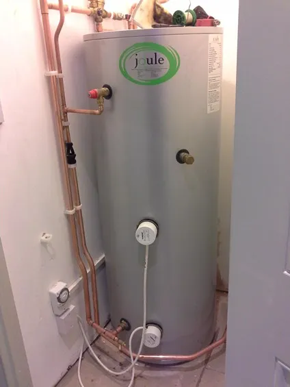 Insulated hot water cylinder installed with new pipework